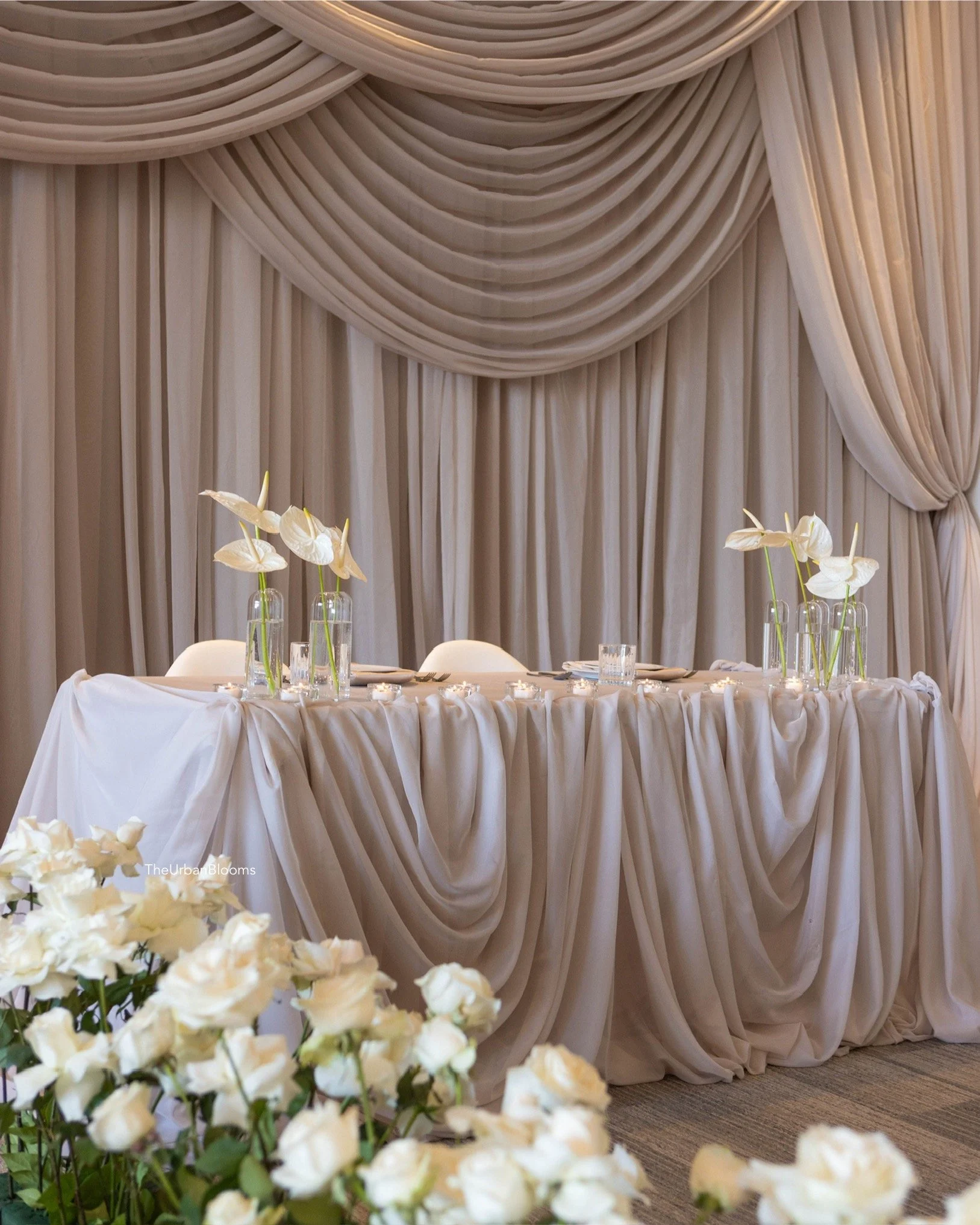 Sweetheart table with roses aisle