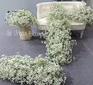 Faux baby's breath waterfall arrangement